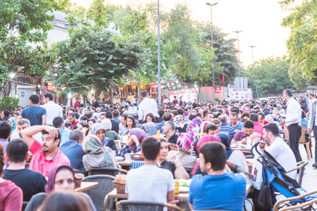 ISTANBUL, TURKEY - JUNE 4, 2017: People are eating iftar(evening meal,dinner) during Ramadan in Suleymaniye square. Suleymaniye district is the most popular place for Ramadan activities in Istanbulのeditorial素材