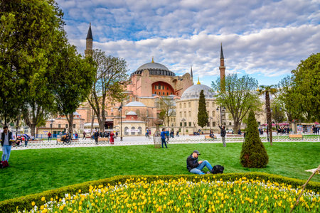Traditional tulip Festival in Sultanahmet Square Park with view of Hagia Sophia,a Greek Orthodox Christian patriarchal basilica (church) on background and colorful tulips on foreground.ISTANBUL,TURKEY- APRIL 4,2017のeditorial素材