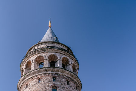 View of Galata Tower(Turkish: Galata Kulesi) called Christ Tower by Genoese a famous medieval landmark architecture in Istanbul, Turkey,February 18,2017.Copy space for editing.のeditorial素材