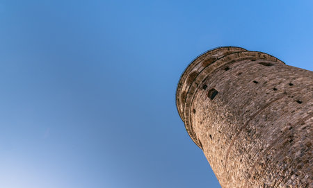 View of Galata Tower(Turkish: Galata Kulesi) called Christ Tower by Genoese a famous medieval landmark architecture in Istanbul, Turkey,February 18,2017.Copy space for editing.のeditorial素材