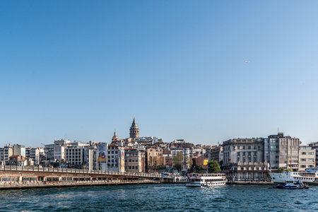 Traditional public ferry going pass near Maiden Tower from Kadikoy to Eminonu pier.ISTANBUL,TURKEY,APRIL 20,2017のeditorial素材