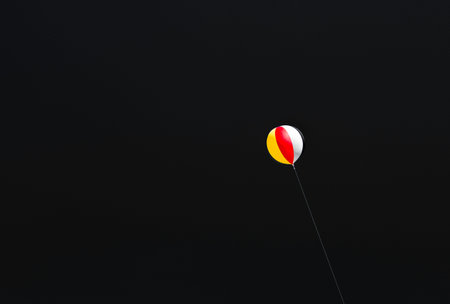 Big Colorful ball against blue black background.Copy space for editing