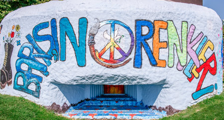 "Colors of peace" is painted on grunge wall with Peace symbol in the middle.Peace concept.のeditorial素材