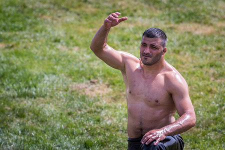Unidentified Turkish people perform oil wrestling.Oil wrestling or grease wrestling (Yagli Gures) is Turkish national sport.ISTANBUL,TURKEY,May 13,2017のeditorial素材