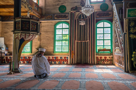 People praying at Camili Camii(mosque),a special mosque which was coverd with wooden boards built in Eighteen century.Artin,Macahel,Turkey,August 18, 2015のeditorial素材