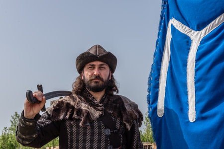 Unidentified man in costume of ancient Turkish troops of ottoman empire soldiers.ISTANBUL,TURKEY,MAY 13,2017のeditorial素材