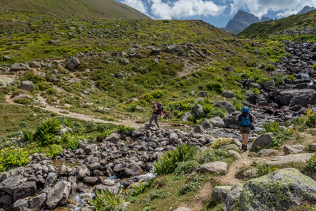 Two unidentified hikers with large backpacks hiking on mountain Kackarlar. Kackar Mountains are a mountain range that rises above the Black Sea coast in eastern Turkeyのeditorial素材