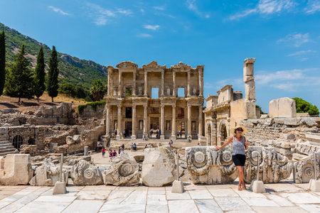 People walking and exploring ancient Celsus Library ruins at Ephesus historical ancient city, in Selcuk,Izmir,Turkey:20 August 2017のeditorial素材