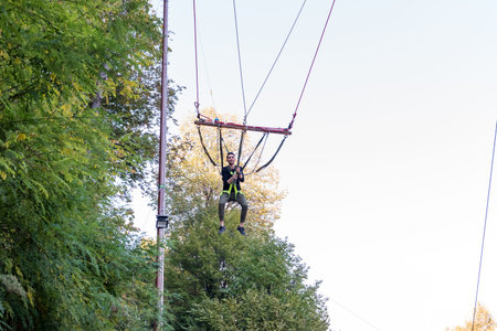 Unidentified man swinging on a machine for fun at Masukiye,a popular destination for locals and...