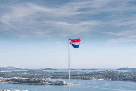 View of  Barone fortress and Croatian flag on the foreground: SIBENIK,CROATIA,May 28,2017の写真素材