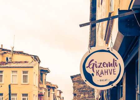Front view of signage on a building with classical architecture.Photo vintage signboard on the street. Signboard on a city building.Vintage sign on an old building.のeditorial素材