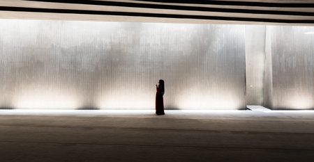 Middle age Muslim woman in red clothes praying in Sancaklar mosque. Buyukcekmece, Istanbul, Turkey - 30 July 2017のeditorial素材