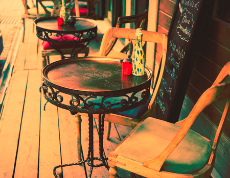 Retro, vintage view of Pastel coffee shop with metallic tables and chairs in Balat, old town of Istanbul, Turkey. Outdoor cafe. Photo in vintage image style.ISTANBUL, TURKEYの写真素材