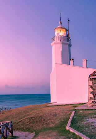Sunset view of old white Inceburun lighthouse on the north coast of Sinop,Turkey.の写真素材