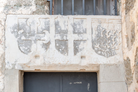 Cross and other signs carved into the wall of ancient Roman marble sculpture in Castle of St. Peter or Bodrum Castle, Turkey.のeditorial素材