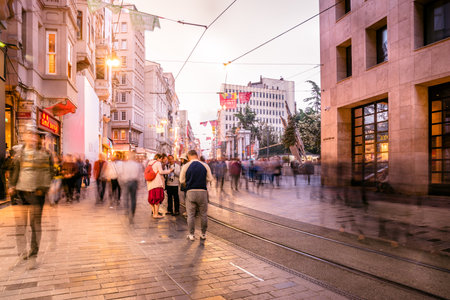 Long exposure or slow shutter speed and blurred image:Unidentified people walk at Istiklal street,popular destination in Istanbul,Turkey.29 April 2018のeditorial素材