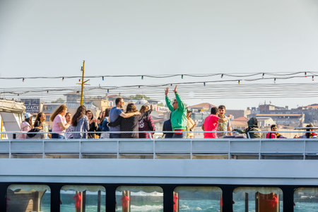 Unidentified people enjoy on ferry with new mosque view on background in Istanbul,Turkey.29 April 2018のeditorial素材