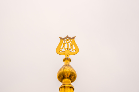 Word of Allah written in Arabic on metallic to put on top of an Islamic building.の写真素材