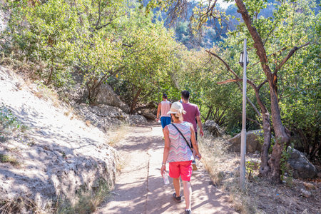 Unidentified people going down to stone slippery stairs towards cave of Chasm of Heaven in Silifke district, Mersin Turkey.29 August 2017.のeditorial素材