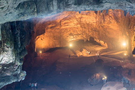 Unidentified people going down to stone slippery stairs towards cave of Chasm of Heaven in Silifke district, Mersin Turkey.の写真素材