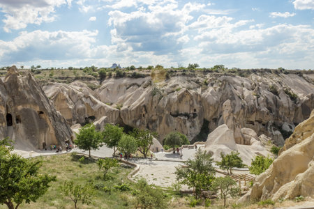 People explore Fairy tale chimneys in Cappadocia with blue sky on background in Goreme,Nevsehir, Turkey.15 June 2014のeditorial素材