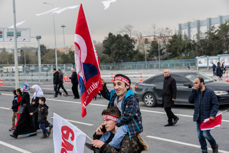 AKP (Justice and Development Party) supporters shout slogans and wave party flags during a yes referendum,plebiscite campaign rally in Istanbul, Yenikapi meeting area.TURKEY, ISTANBUL, APRIL 8, 2017のeditorial素材