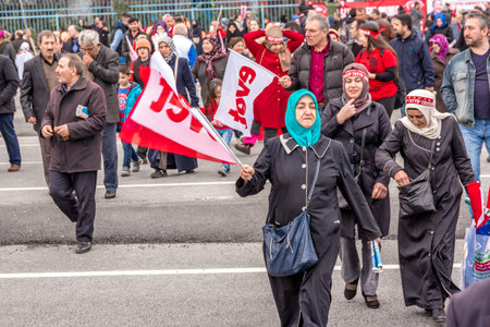AKP (Justice and Development Party) supporters shout slogans and wave party flags during a yes referendum,plebiscite campaign rally in Istanbul, Yenikapi meeting area.TURKEY, ISTANBUL, APRIL 8, 2017のeditorial素材