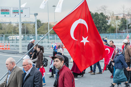 AKP (Justice and Development Party) supporters shout slogans and wave party flags during a yes referendum,plebiscite campaign rally in Istanbul, Yenikapi meeting area.TURKEY, ISTANBUL, APRIL 8, 2017のeditorial素材