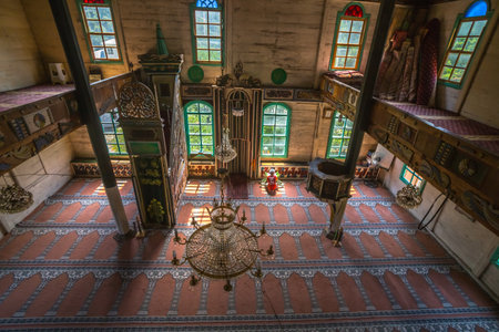Child praying at Camili Camii(mosque),a special mosque which was coverd with wooden boards built in Eighteen century.Artin,Macahel,Turkey,August 18, 2015のeditorial素材