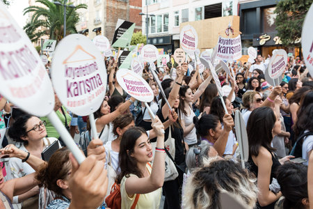 Women Protesters rally in kadikoy against interfering women clothes. Women carryDo not touch my...