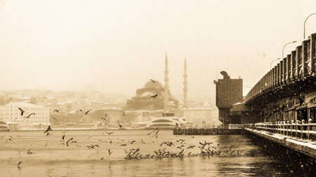 TURKEY, ISTANBUL, JANUARY 07, 2017: Heaviest snowfall in Istanbul.Galata bridge and New Mosque is an Ottoman imperial mosque located in the Eminönü quarter of Istanbul, Turkeyのeditorial素材