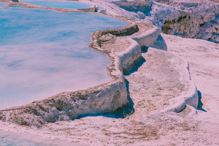 Turquoise color view of Pamukkale (Cotton Castle) is popular with Travertine pools and terraces  where people love to visit in Pamukkale, Turkey.の写真素材