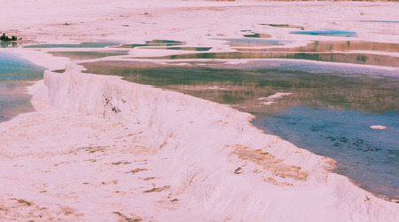 Turquoise color view of Pamukkale (Cotton Castle) is popular with Travertine pools and terraces  where people love to visit in Pamukkale, Turkey.の写真素材