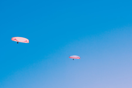 Paragliding over Pamukkale (Cotton Castle)that is popular with Travertine pools and terraces  and a paraglide on the air.の写真素材