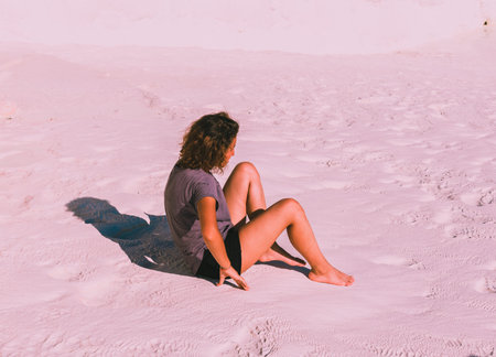 Unidentified woman sits at Pamukkale (Cotton Castle) that is popular with Travertine pools and...