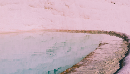 Turquoise color view of Pamukkale (Cotton Castle) is popular with Travertine pools and terraces  where people love to visit in Pamukkale, Turkey.の写真素材