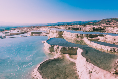 Turquoise color view of Pamukkale (Cotton Castle) is popular with Travertine pools and terraces  where people love to visit in Pamukkale, Turkey.の写真素材