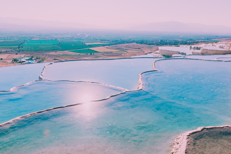 Turquoise color view of Pamukkale (Cotton Castle) is popular with Travertine pools and terraces  where people love to visit in Pamukkale, Turkey.の素材 [FY310106520670]