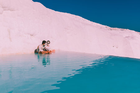 Unidentified people swim at Pamukkale (Cotton Castle) that is popular with Travertine pools and terraces  where people love to visit in Pamukkale,Turkey.25 August,2017のeditorial素材
