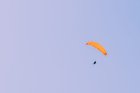 Paragliding over Pamukkale (Cotton Castle)that is popular with Travertine pools and terraces  and a paraglide on the air.の写真素材