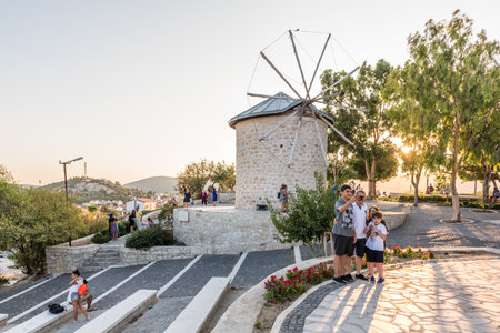 People visit ancient old stone windmills on a sunny day in Alacati town, a popular destination for traveling and holiday in Izmir,Turkey.26 August 2017.のeditorial素材