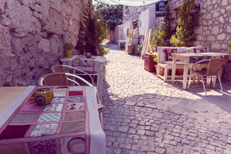 HDR Image-Unidentified people walking at Alacati charming Streets , a popular destination for traveling and vacation in Izmir,Turkey.26 August 2017.のeditorial素材