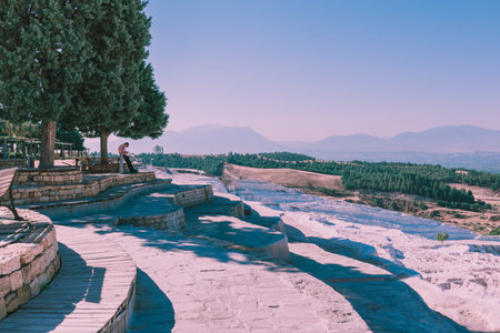 Turquoise color view of Pamukkale (Cotton Castle) is popular with Travertine pools and terraces  where people love to visit in Pamukkale, Turkey.25 August 2017のeditorial素材