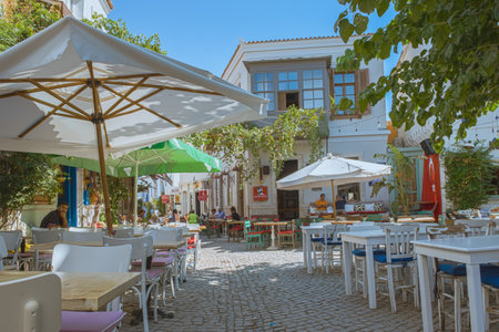 HDR Image-Unidentified people walking at Alacati charming Streets , a popular destination for traveling and vacation in Izmir,Turkey.26 August 2017.のeditorial素材