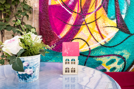 Retro View of a cafe table and a decoration at Alacati charming Streets , a popular destination for traveling and vacation in Izmir,Turkey.の写真素材