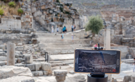 Cell,mobile phone takes photo of ancient ruins at Ephesus historical ancient city, in Selcuk,Izmir,Turkey:20 August 2017のeditorial素材