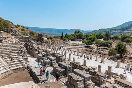 People visit Odeon (Bouleuterion) at ancient ruins at Ephesus historical ancient city, in...