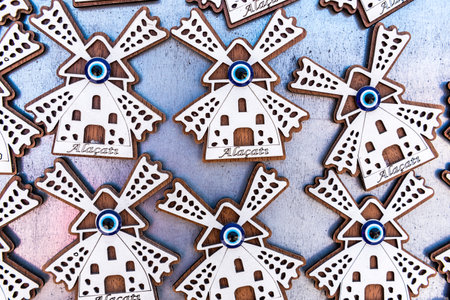 Many wooden souvenirs  representing popular Alacati  windmills in Izmir,Turkey.のeditorial素材