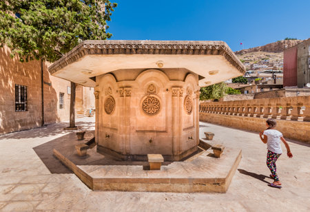 Unidentified child plays at courtyard of Abdullatif Mosque which was built during Artuklu period in Mardin,Turkey.17 June 2018のeditorial素材