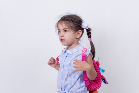 Portrait of cute girl in school uniform is ready to go school.Copy space for editing.の写真素材